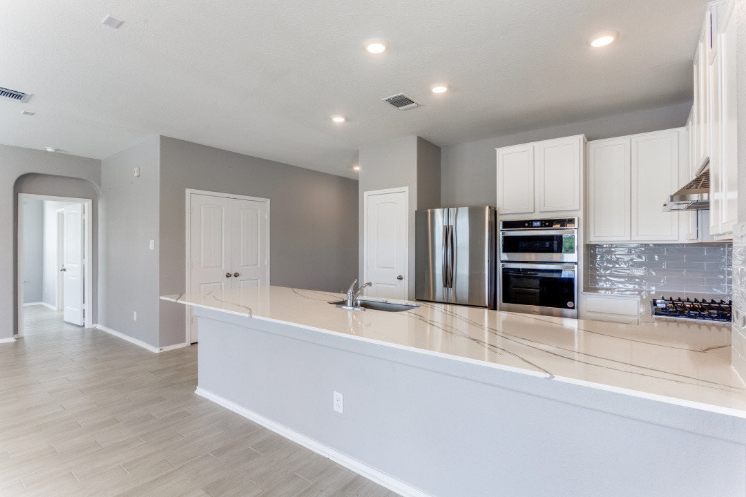 1100 Desaix Drive Georgetown, TX 78628 - Photo 10 of 25 a large kitchen with stainless steel appliances and a refrigerator