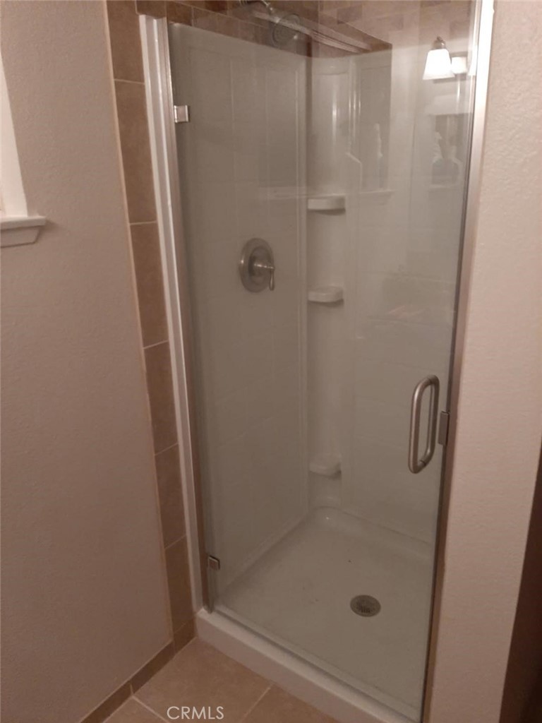 340 North 9th Street Blythe, CA 92225 - Photo 10 of 10 a bathroom with a glass shower door