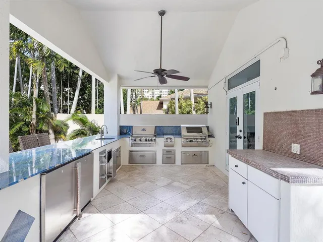 a kitchen with counter top space and stainless steel appliances