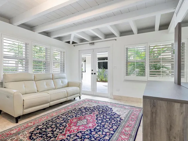 a living room with furniture and a rug