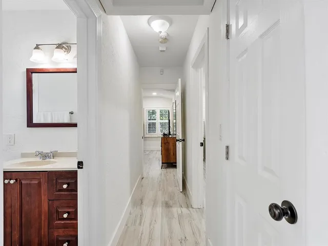 a bathroom with a sink and mirror