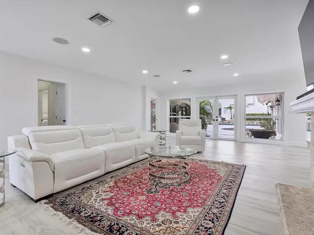 a living room with furniture and a rug