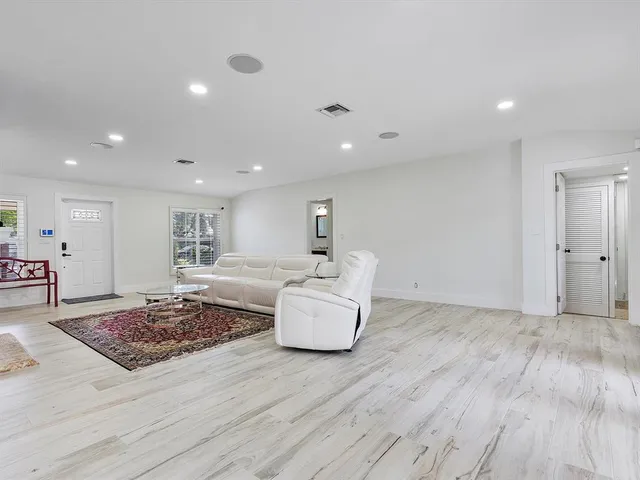 a living room with furniture and chair