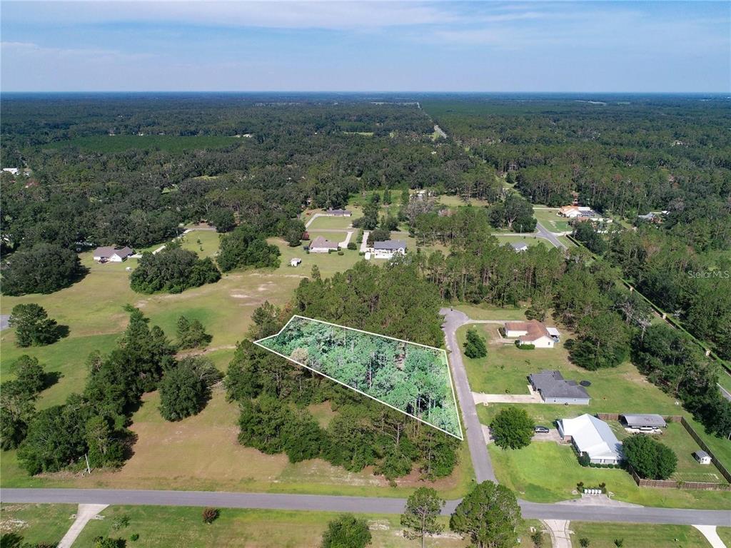 0 88th Trail Live Oak, FL 32060 - Photo 12 of 12 an aerial view of residential houses with outdoor space and trees