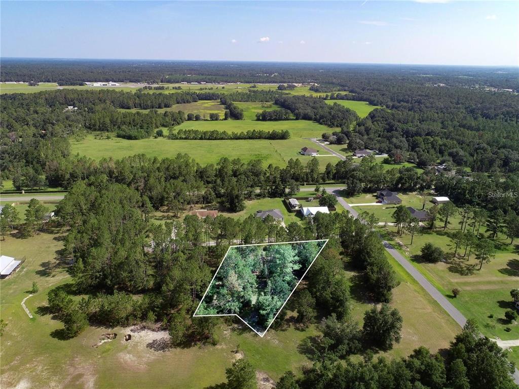 0 88th Trail Live Oak, FL 32060 - Photo 9 of 12 an aerial view of residential houses with outdoor space and trees