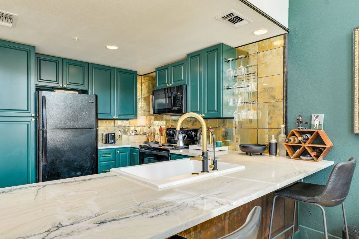 110 South Main Street, Unit 101 Elgin, TX 78621 - Photo 11 of 35 a kitchen with refrigerator and window