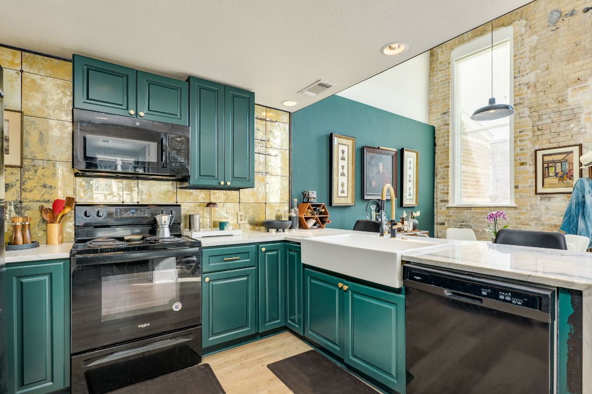 110 South Main Street, Unit 101 Elgin, TX 78621 - Photo 13 of 35 a kitchen with a sink stove and microwave