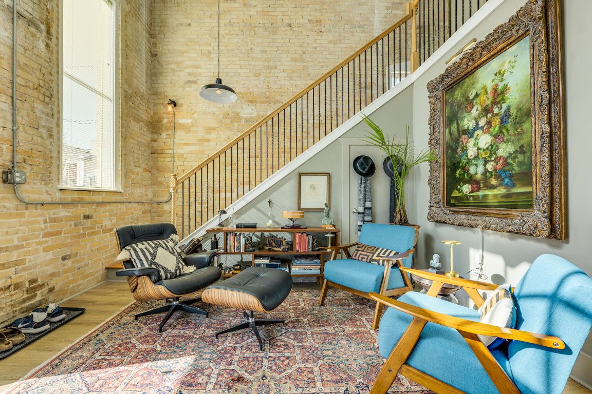 110 South Main Street, Unit 101 Elgin, TX 78621 - Photo 20 of 35 a living room with furniture and a floor to ceiling window