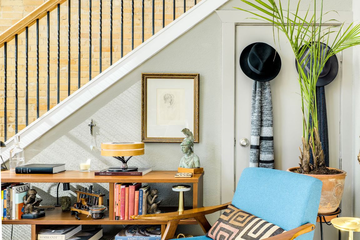 110 South Main Street, Unit 101 Elgin, TX 78621 - Photo 23 of 35 a living room with furniture and a potted plant