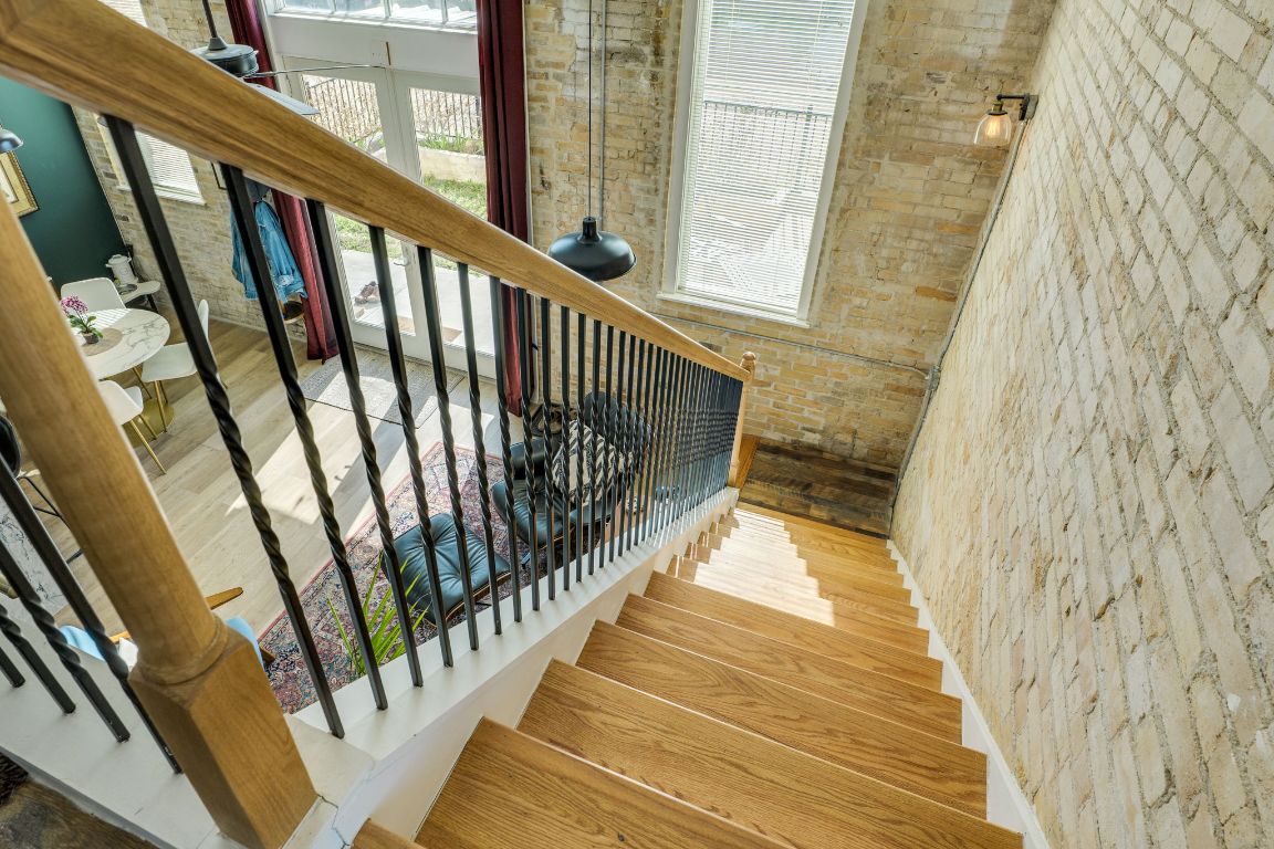 110 South Main Street, Unit 101 Elgin, TX 78621 - Photo 26 of 35 a view of a balcony with wooden floor