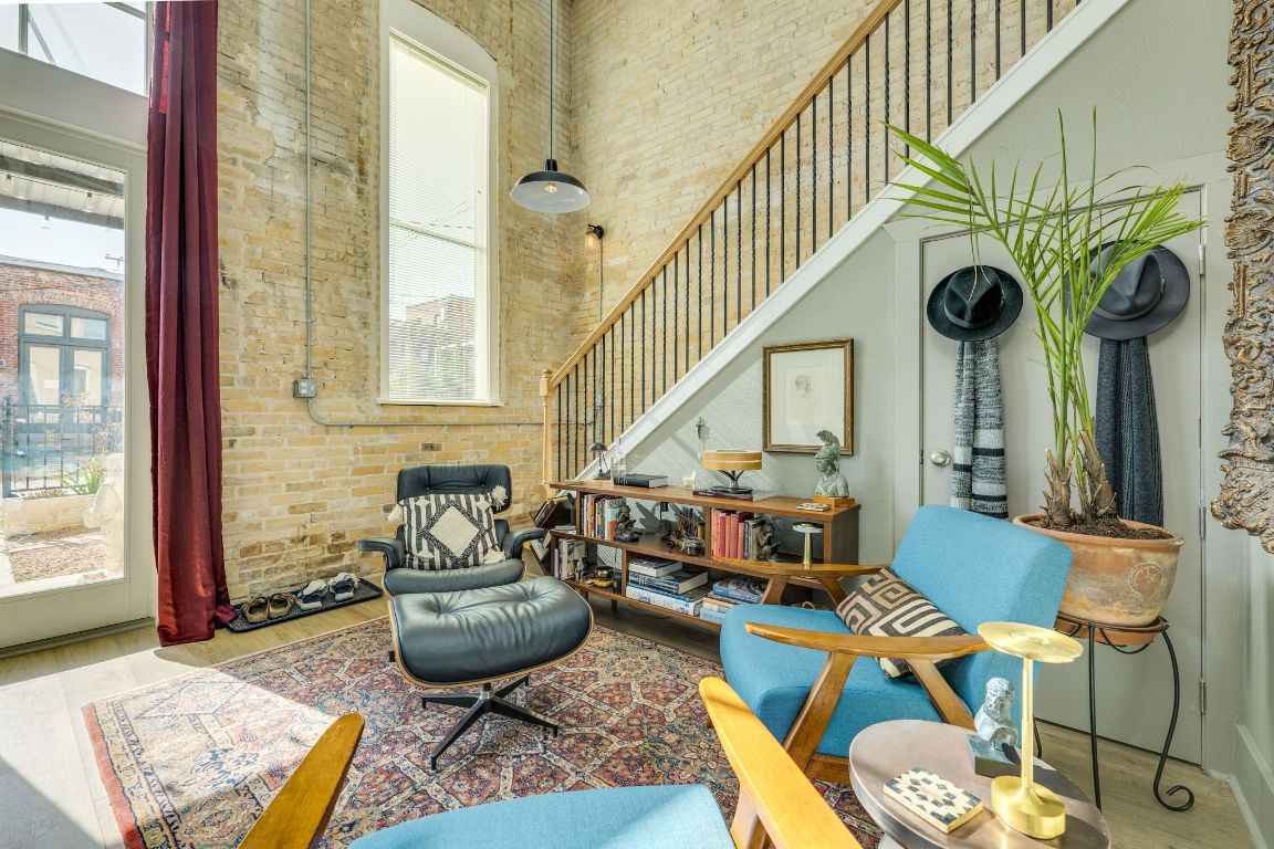 110 South Main Street, Unit 101 Elgin, TX 78621 - Photo 3 of 35 a living room with furniture and a large window