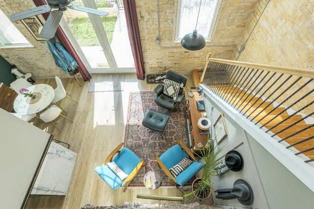 a view of living room with furniture and floor to ceiling window