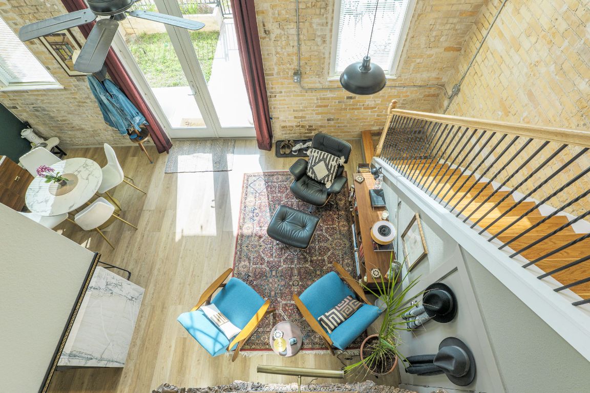 110 South Main Street, Unit 101 Elgin, TX 78621 - Photo 32 of 35 a view of living room with furniture and floor to ceiling window