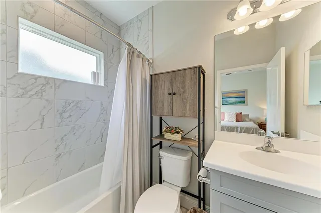 a view of a workspace with furniture and a flat screen tv