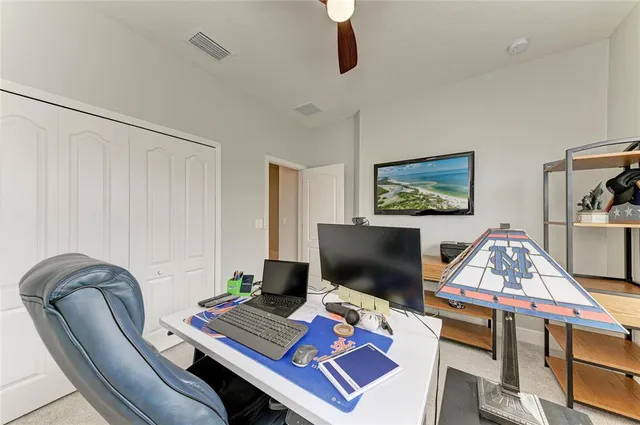 an aerial view of residential houses with outdoor space and trees