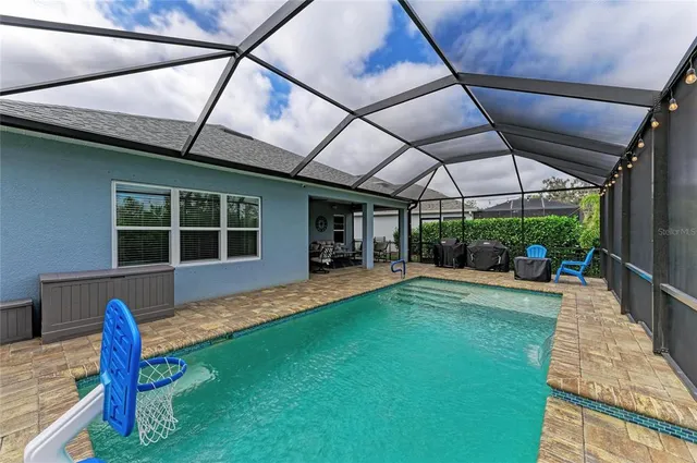 a view of a yard with plants and trees