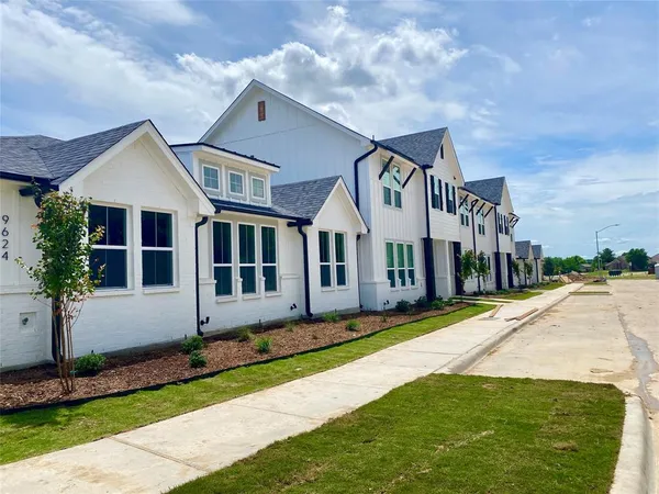 a house with yard in front of it
