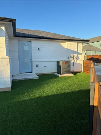 a view of a back yard of the house with a big yard