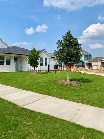 a view of a house with a big yard
