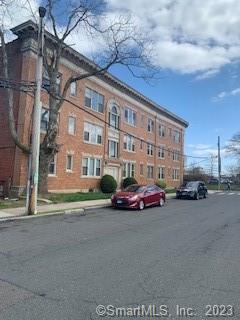 2 Fraser Place, Unit A Hartford, CT 06105 - Photo 1 of 1 a front view of a building with lot of cars
