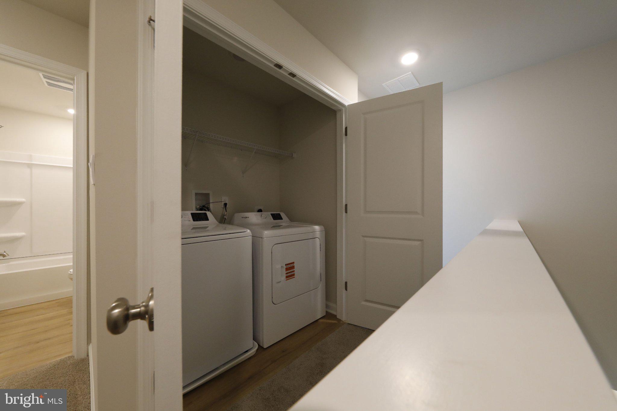 23 Clementon Road East Gibbsboro, NJ 08026 - Photo 21 of 31 Modern laundry nook with sleek appliances.