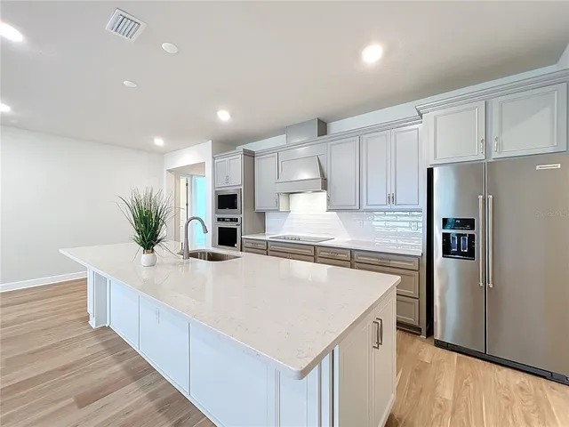 a bathroom with a sink a vanity and a mirror