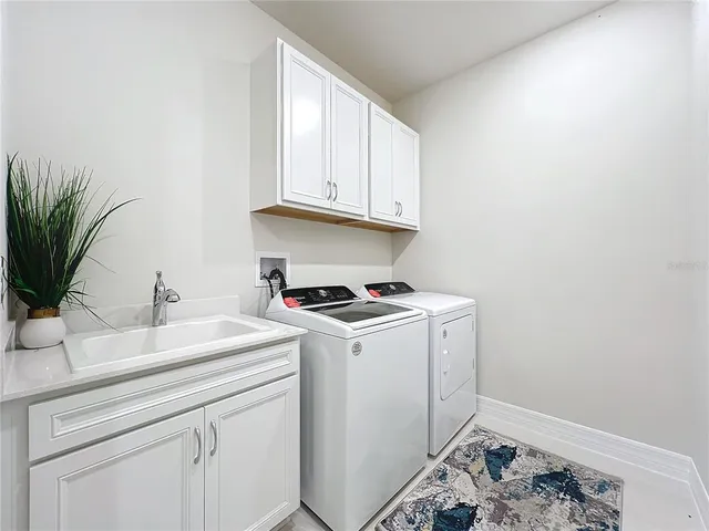a view of a swimming pool with a table and chairs