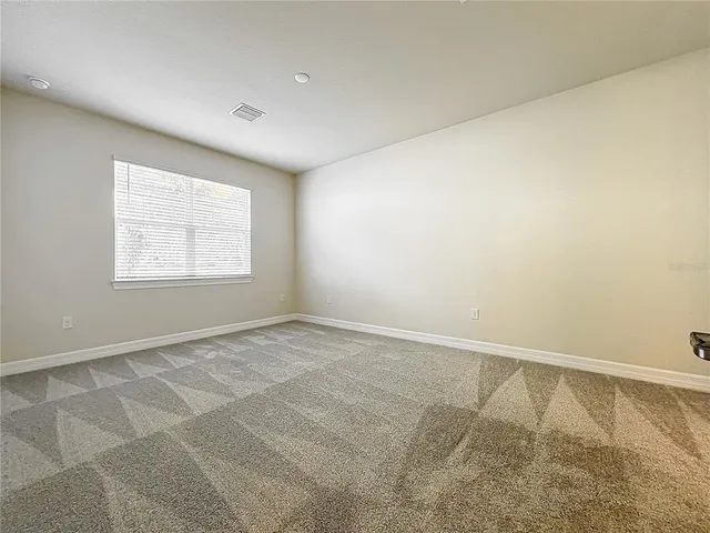 a view of a house with swimming pool and sitting area
