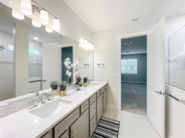 an aerial view of a residential houses with outdoor space and swimming pool