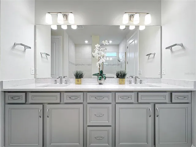 an aerial view of a house with a ocean view