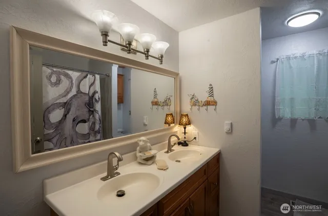a bathroom with a sink and a mirror