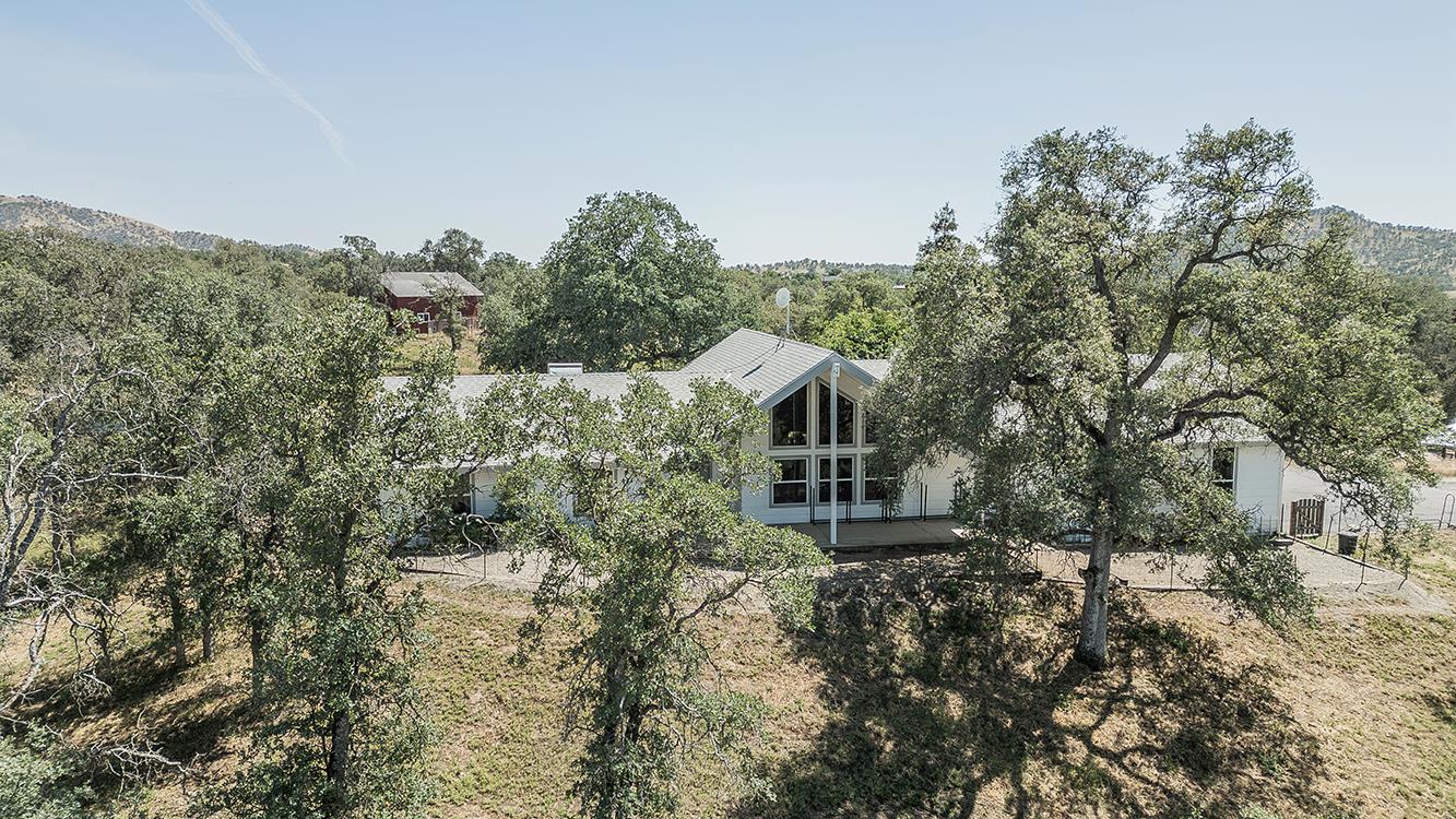 14815 Garlock Lane Prather, CA 93651 - Photo 67 of 80 a aerial view of a house with a yard and mountain view in back