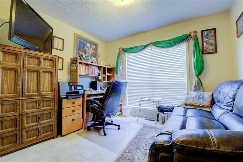 4270 Berkeley Mill Lane Duluth, GA 30096 - Photo 12 of 28 a view of a livingroom with workspace and a window