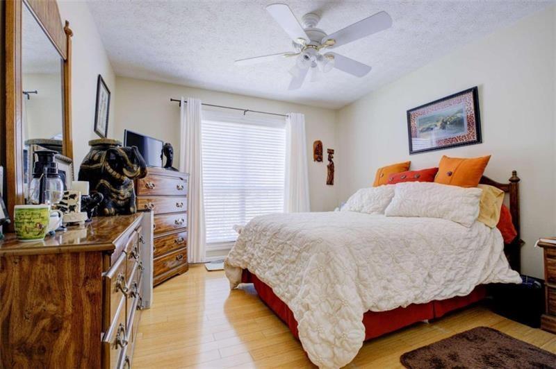 4270 Berkeley Mill Lane Duluth, GA 30096 - Photo 13 of 28 a bedroom with a bed and a walk in closet