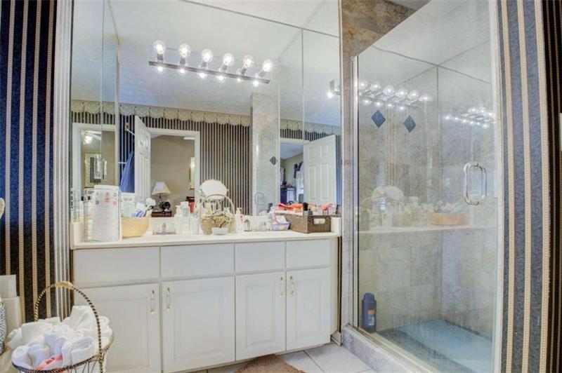 4270 Berkeley Mill Lane Duluth, GA 30096 - Photo 16 of 28 a bathroom with a double vanity sink mirror and shower