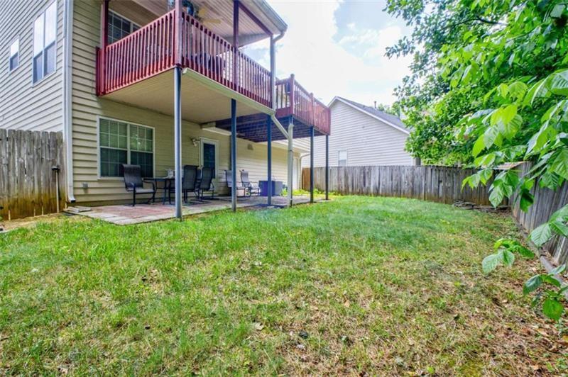 4270 Berkeley Mill Lane Duluth, GA 30096 - Photo 28 of 28 a view of a house with a yard and sitting area