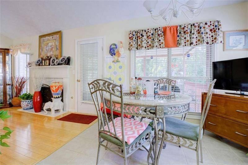 4270 Berkeley Mill Lane Duluth, GA 30096 - Photo 8 of 28 a dining room with furniture and wooden floor