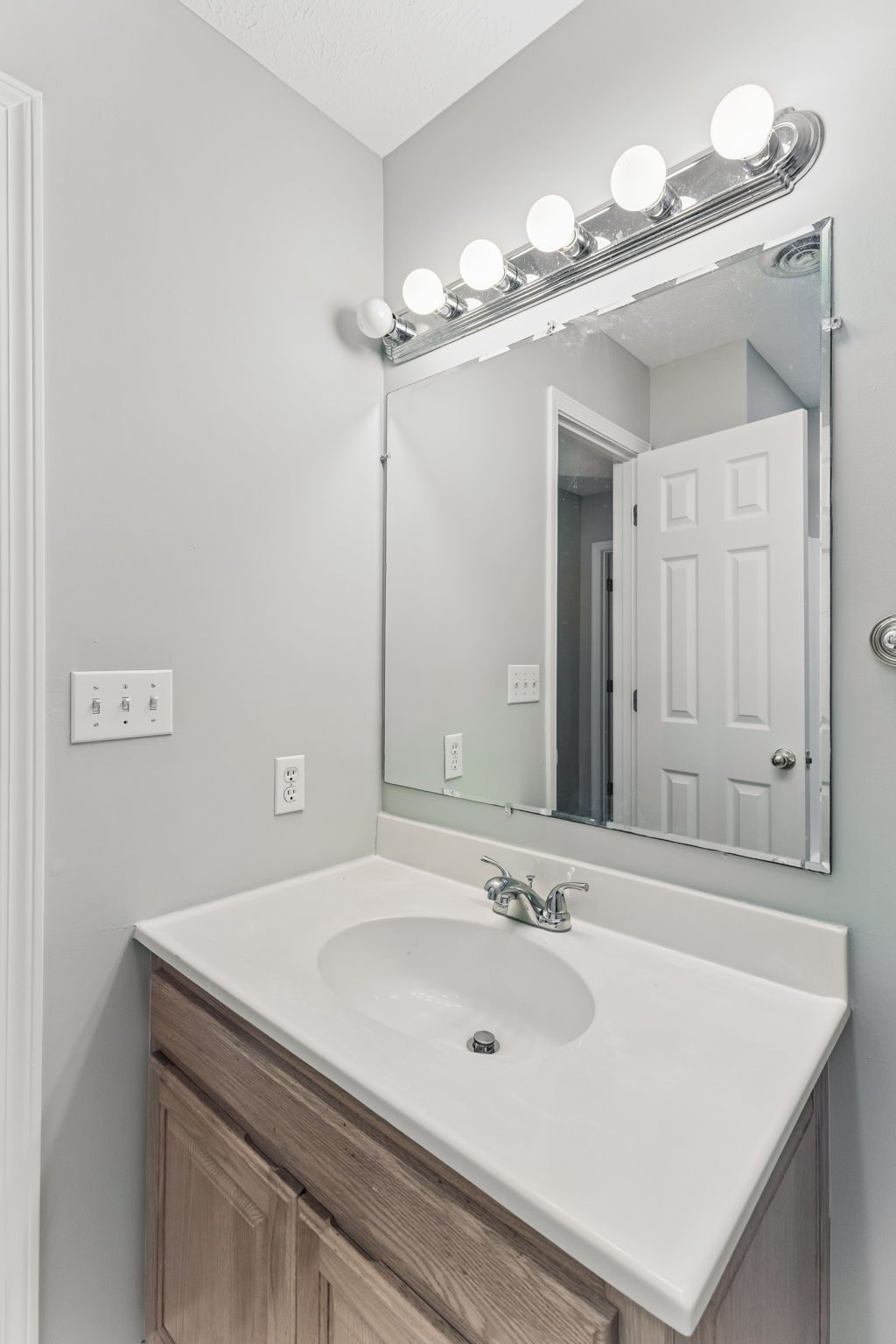 831 Defeated Creek Road Centerville, TN 37033 - Photo 14 of 26 a bathroom with a sink a mirror and a shower