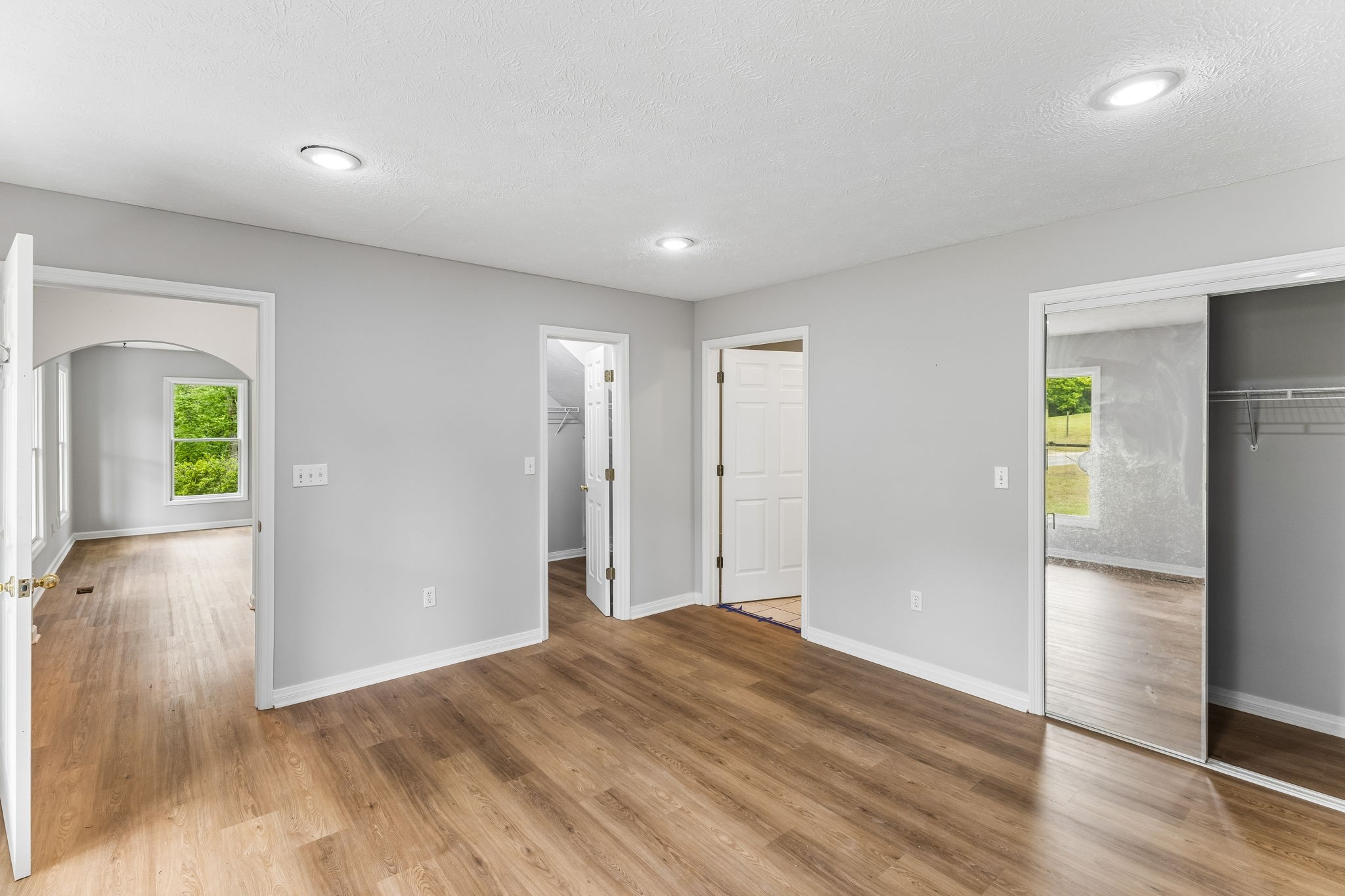 831 Defeated Creek Road Centerville, TN 37033 - Photo 6 of 26 an empty room with wooden floor and windows