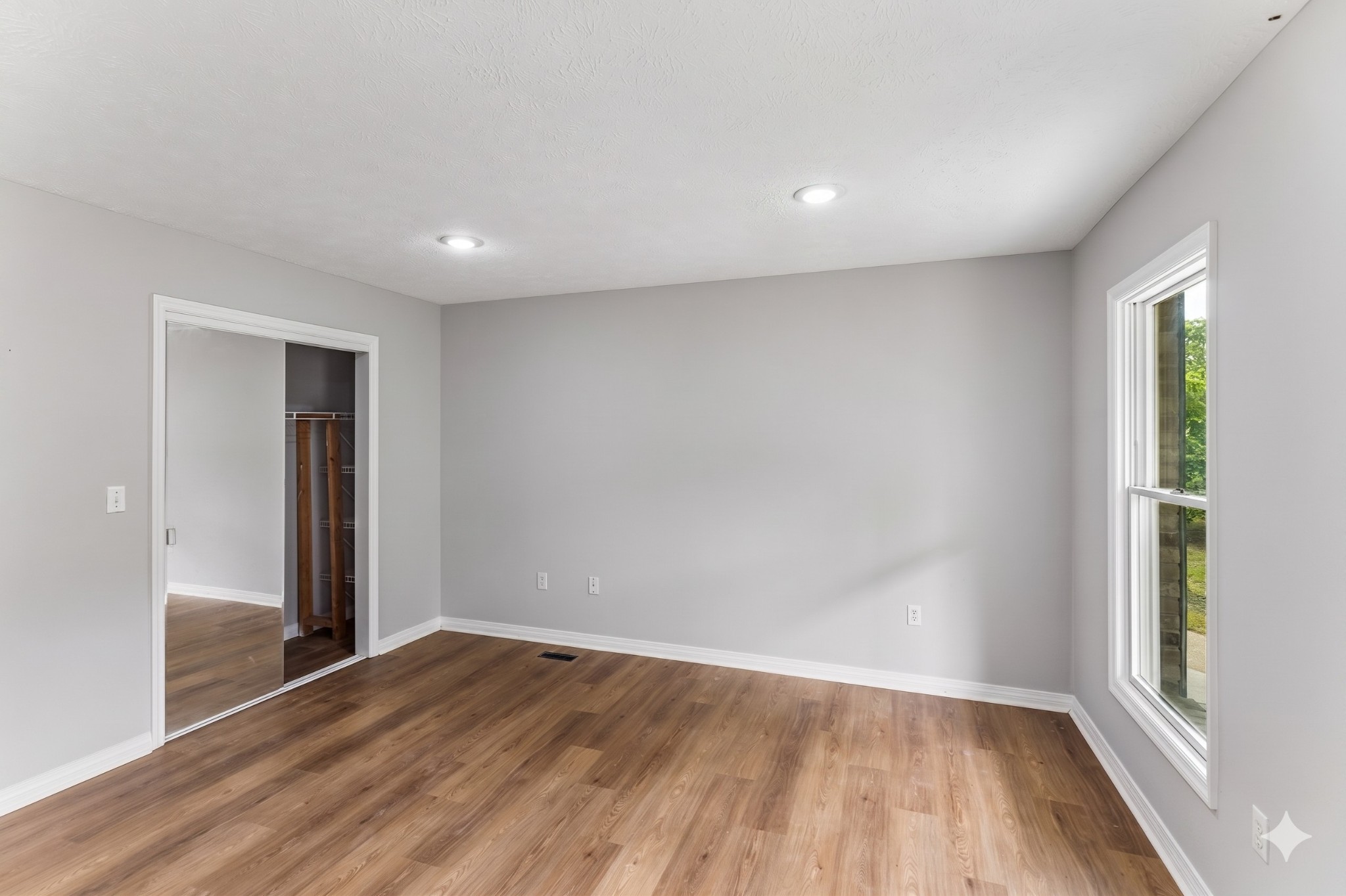 831 Defeated Creek Road Centerville, TN 37033 - Photo 10 of 26 wooden floor in an empty room with a window