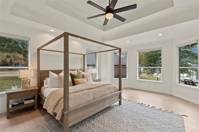 a bedroom with a large bed and a window