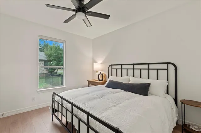 a bedroom with a large bed and a window