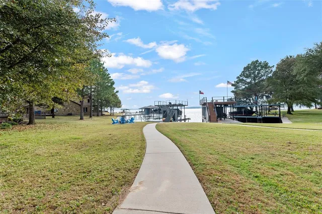 a swimming pool with outdoor seating yard and barbeque oven
