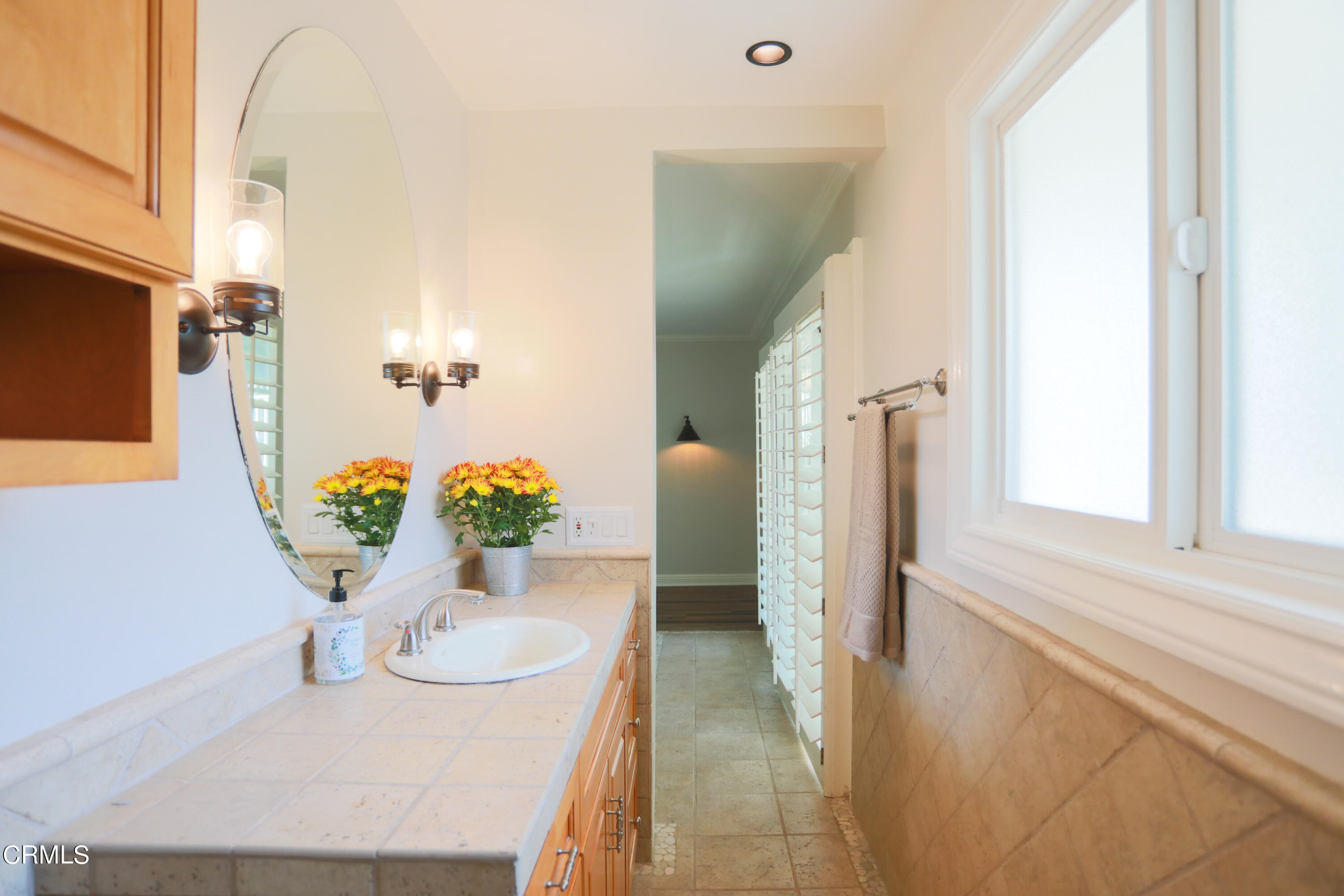 7438 Alpine Way Tujunga, CA 91042 - Photo 11 of 30 a view of a dining room with furniture and a potted plant