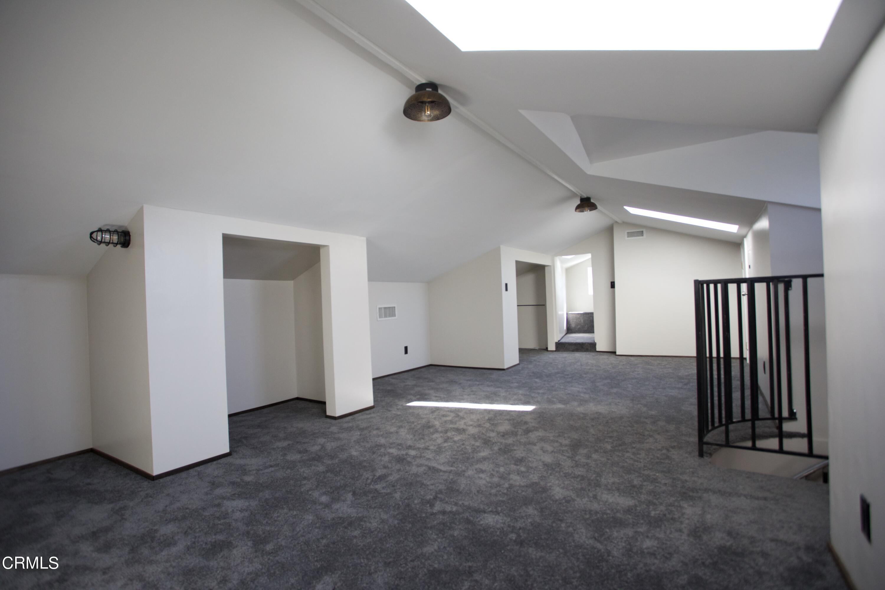 7438 Alpine Way Tujunga, CA 91042 - Photo 18 of 30 an empty room with windows