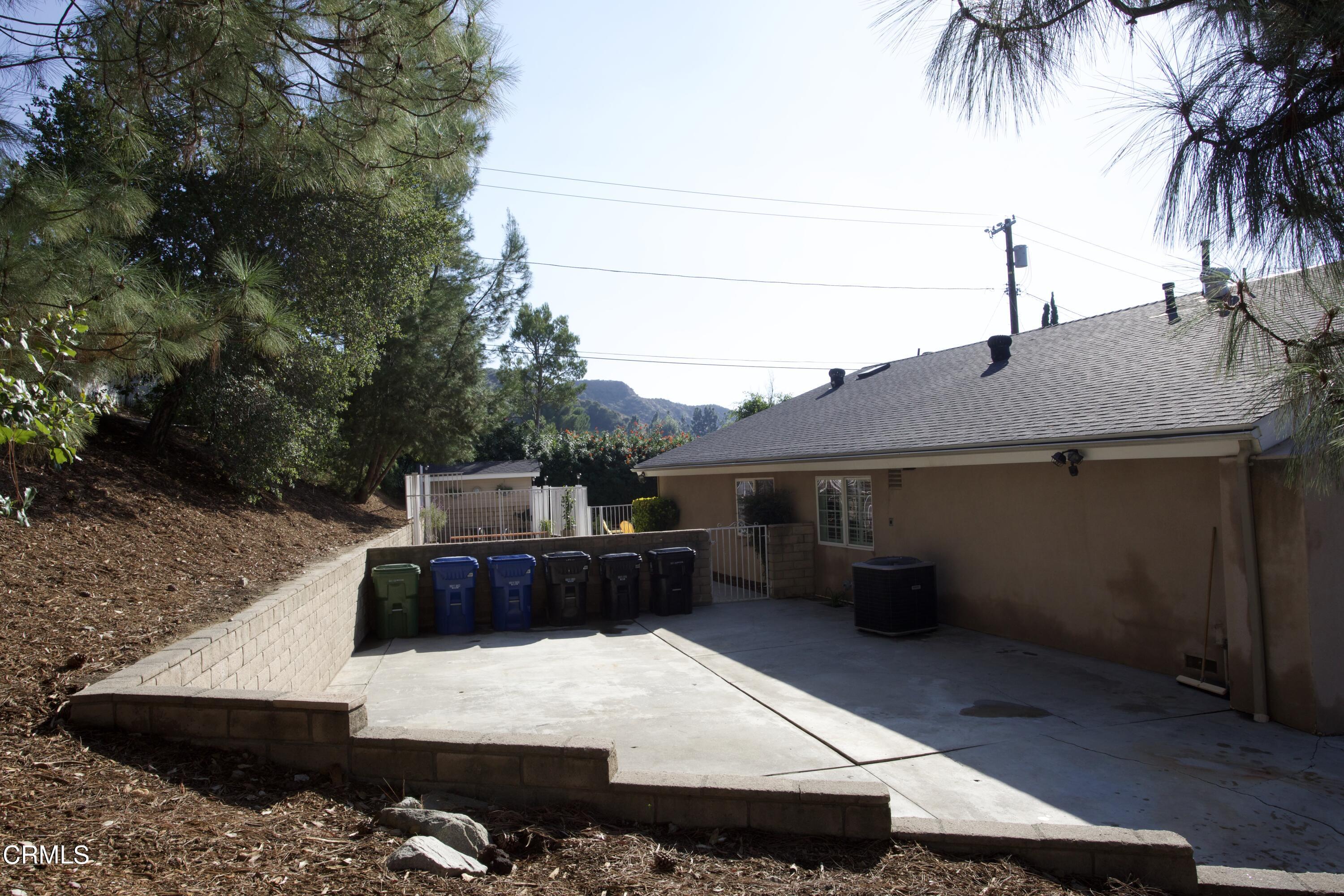 7438 Alpine Way Tujunga, CA 91042 - Photo 27 of 30 a terrace of a house with outdoor seating