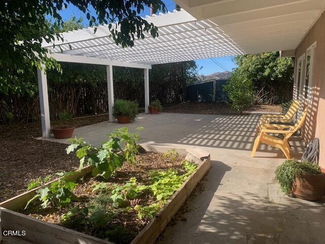 7438 Alpine Way Tujunga, CA 91042 - Photo 28 of 30 a view of a chairs and table in backyard of the house