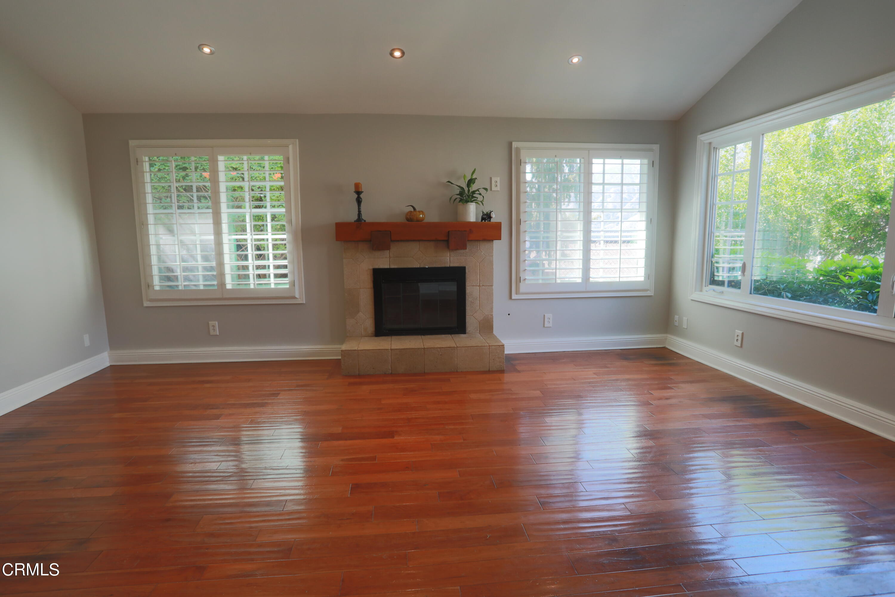 7438 Alpine Way Tujunga, CA 91042 - Photo 8 of 30 a view of an empty room with wooden floor and a window