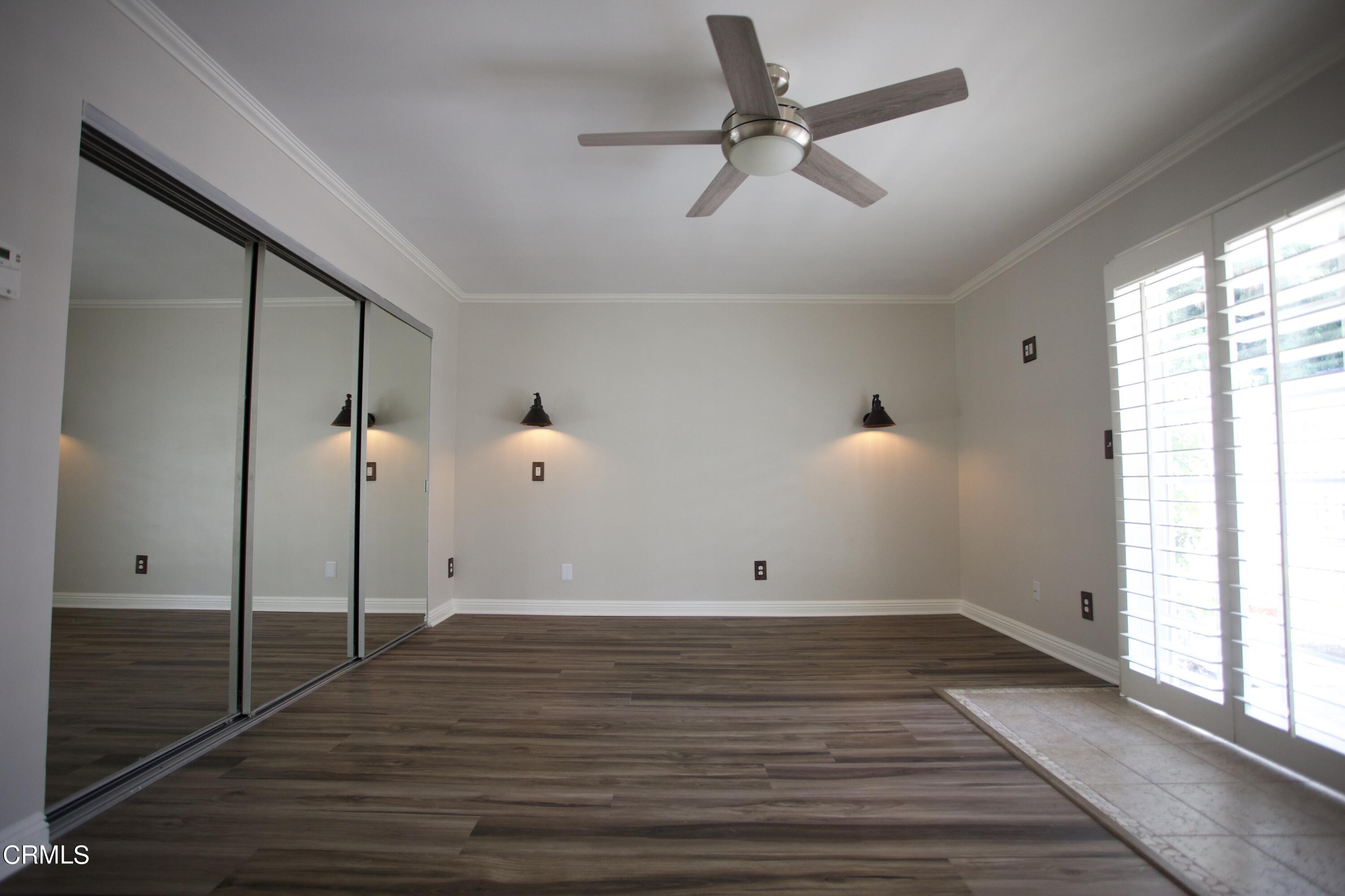 7438 Alpine Way Tujunga, CA 91042 - Photo 9 of 30 a view of a room with wooden floor and window