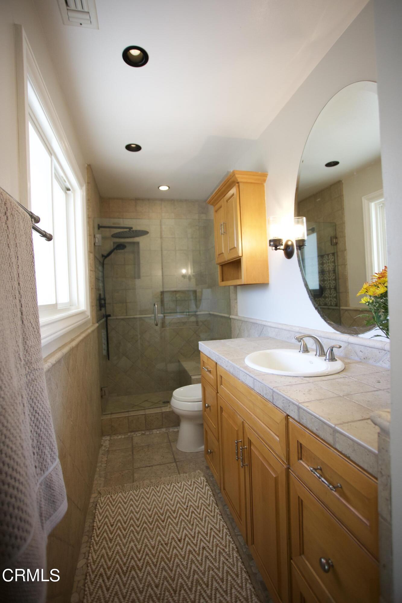 7438 Alpine Way Tujunga, CA 91042 - Photo 10 of 30 a bathroom with a sink toilet and shower
